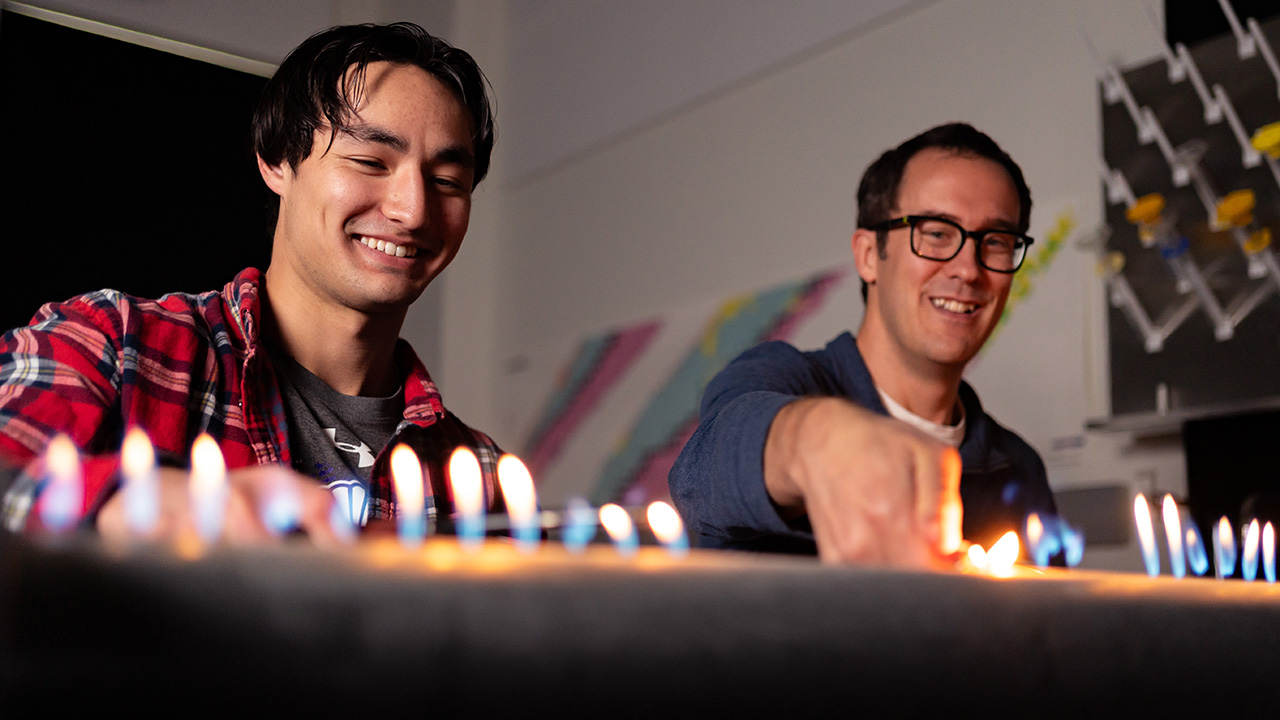 WSU student and faculty member conducting a science experiment