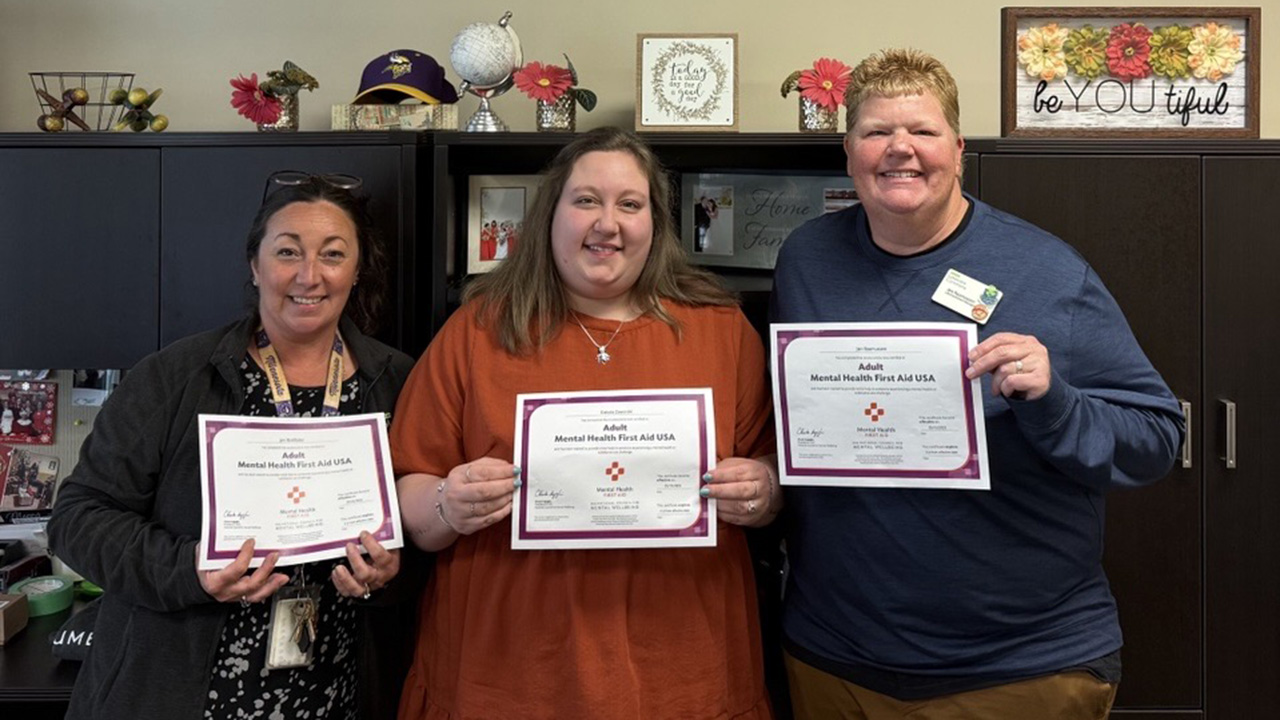 Ecumen partners holding MHFA certificates.