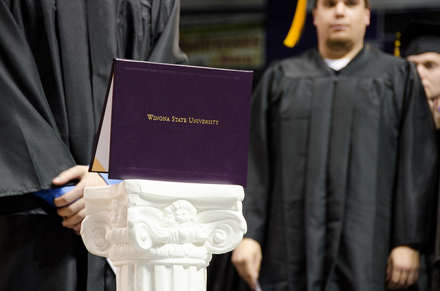a graduate receiving his diploma