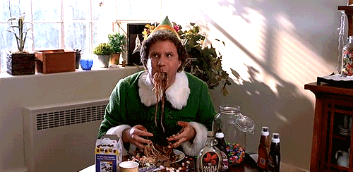 Buddy the Elf messily eats candy and pasta