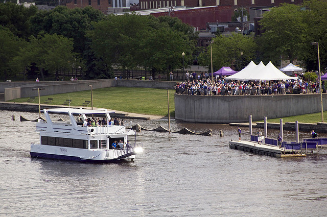 Loaded with passengers, the Cal Fremling boat arrives at Levee Park dock in Winona, MN.