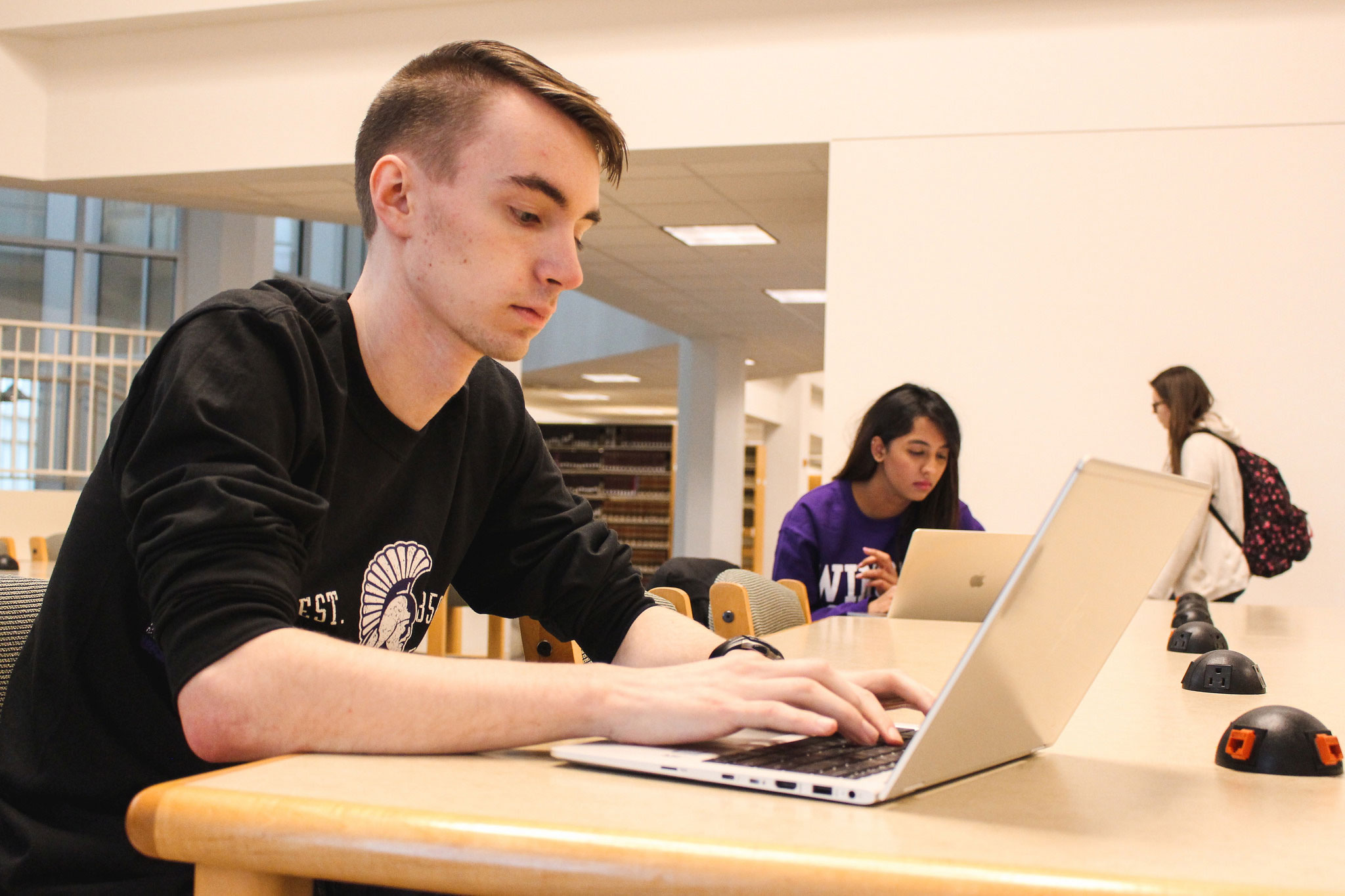 WSU student registering for scholarships on their laptop in the WSU library.
