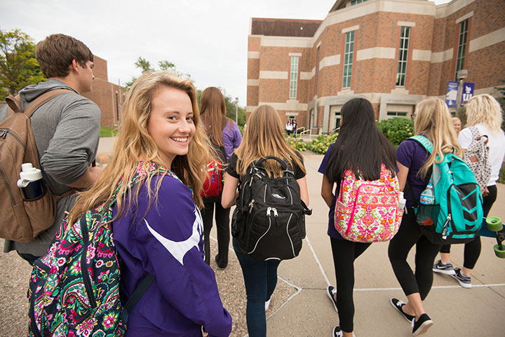 Students walking together across campus.
