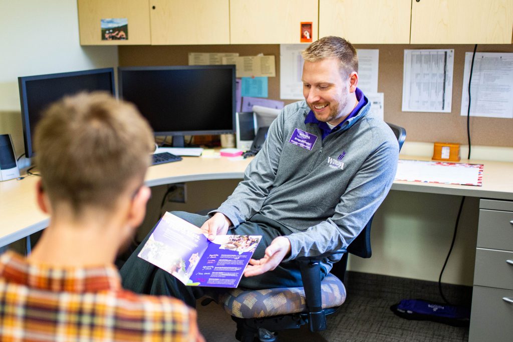 A student talking with an Admissions counselor.