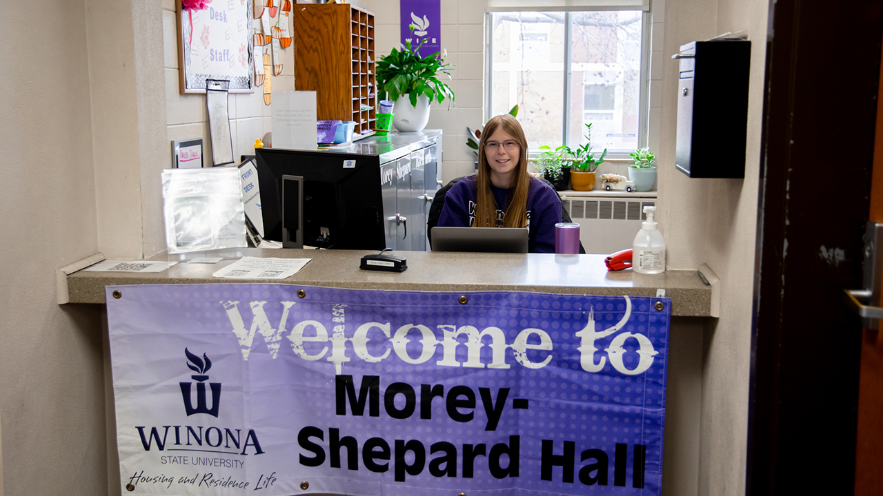 Front desk of Morey-Shepard Hall with sign that reads "Welcome to Morey-Shepard Hall."