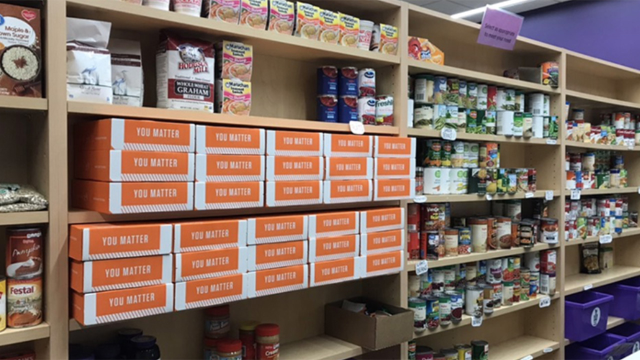 Shelves stocked with food in the Warrior Cupboard.