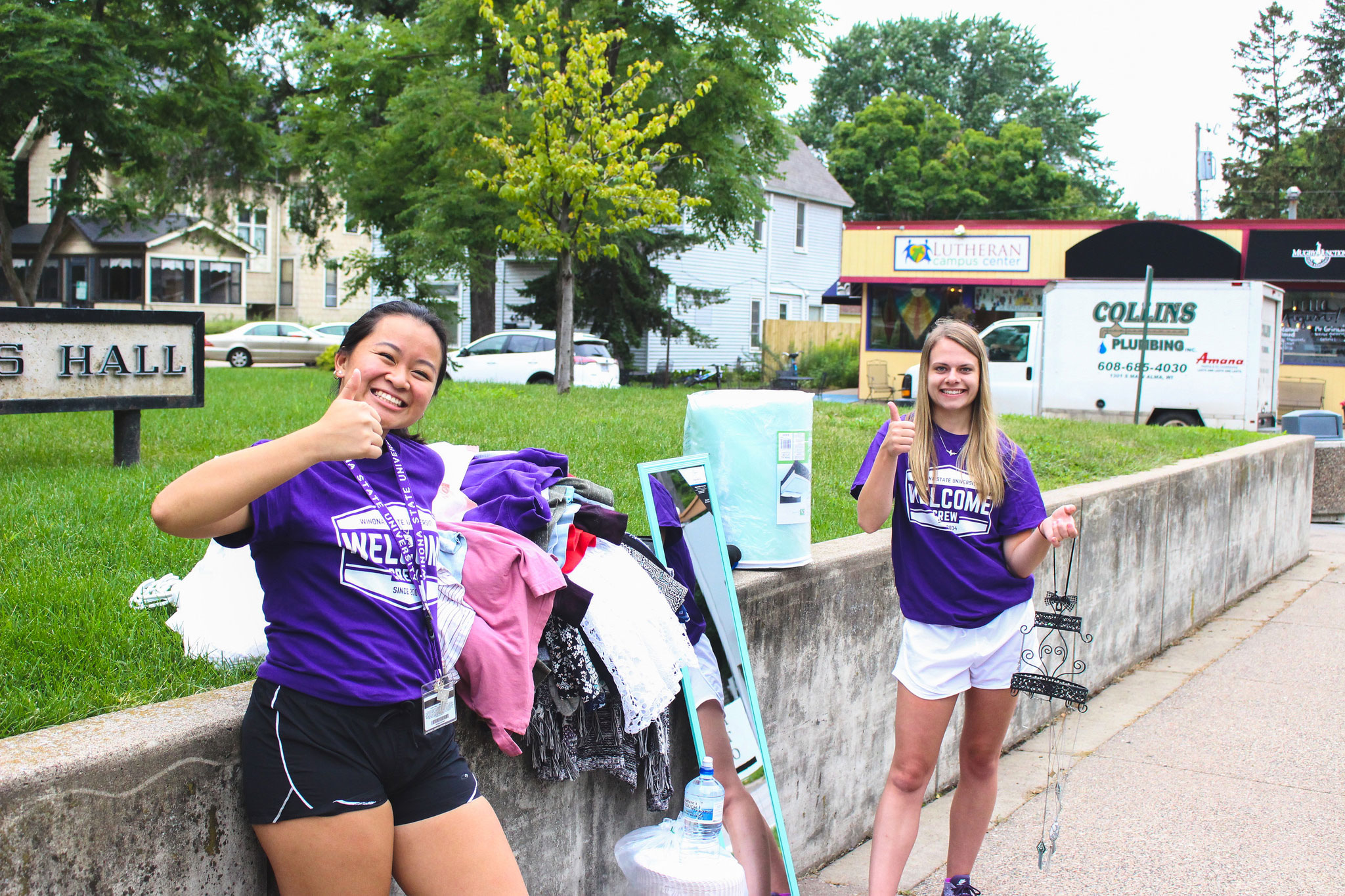 Two WSU students helping a new freshman move-in.