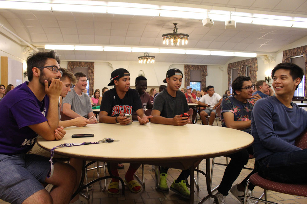 Students attending a hall council meeting in the residence halls.