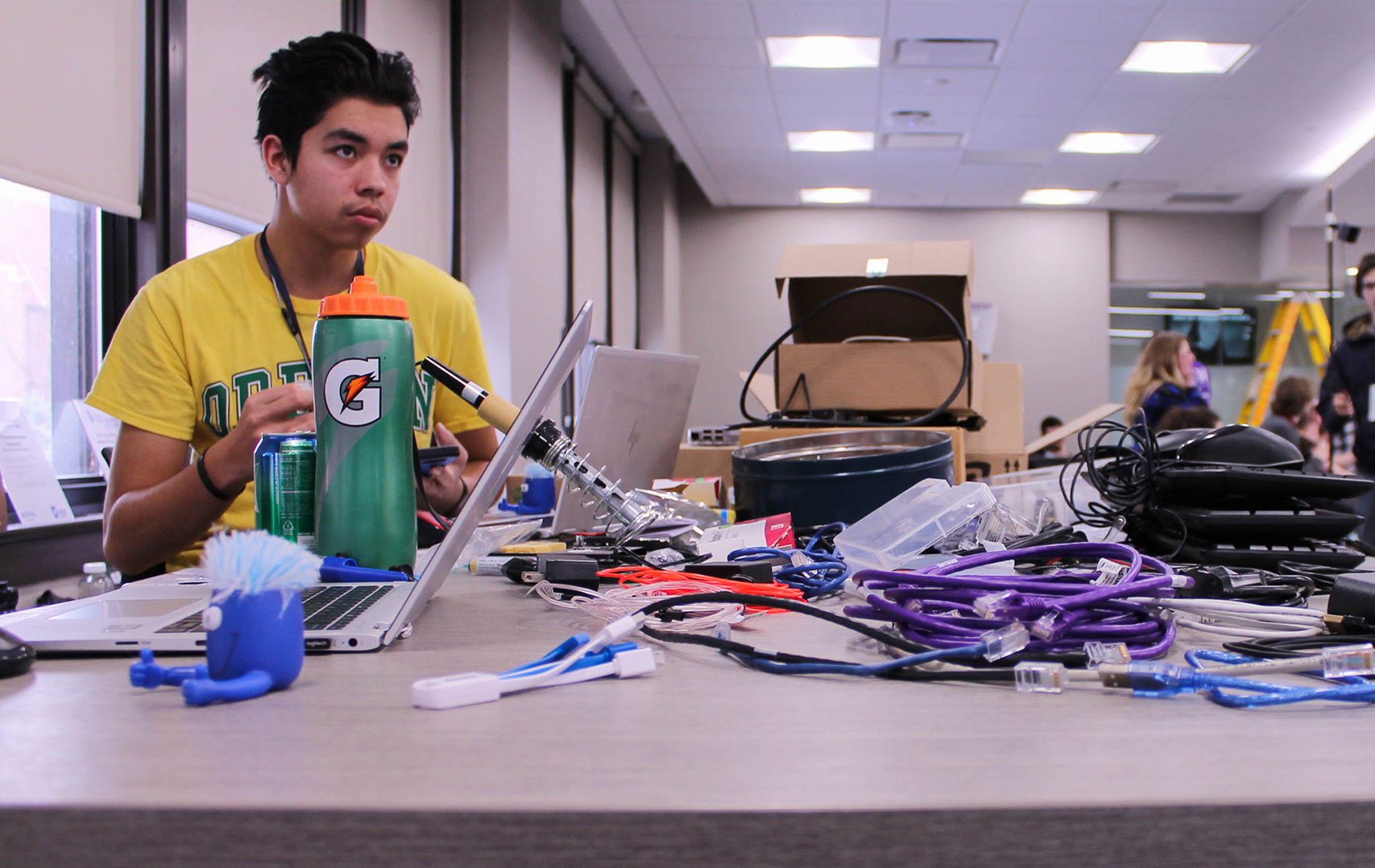 A student working on a project at the WSU Hackathon event on campus.