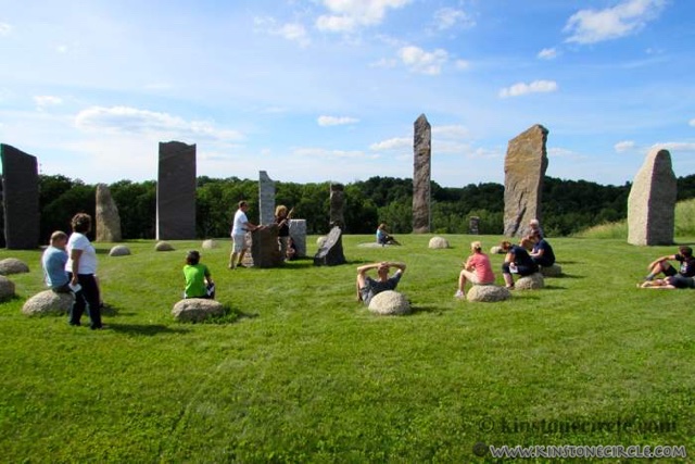 Kristine Beck talks to visitors in the stone circle at Kinstone. Photo by Linda Kihslinger.