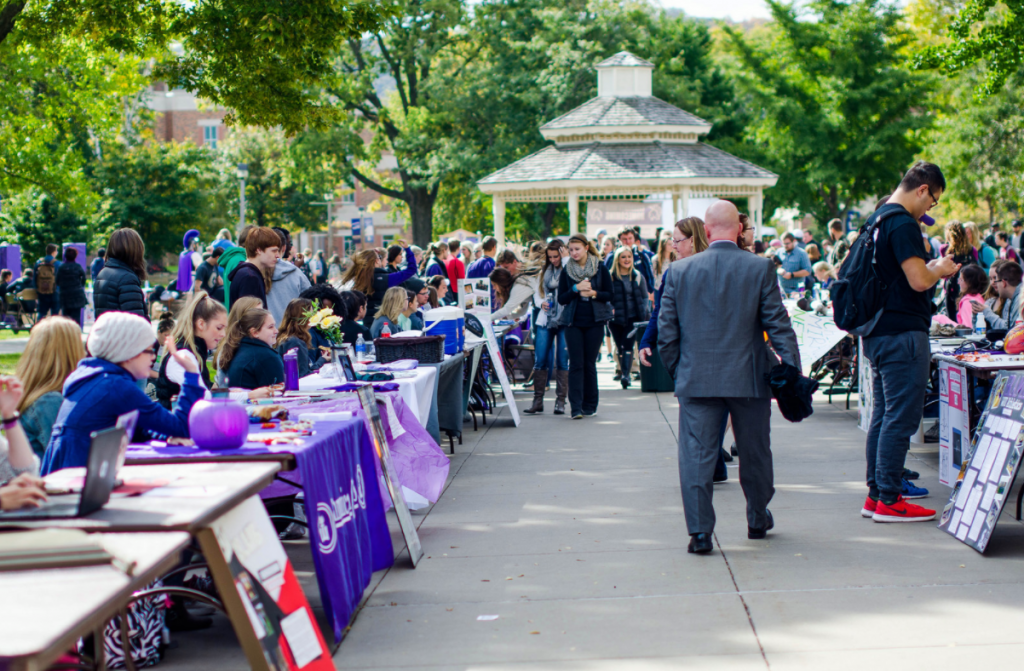 WSU Homecoming - Crowd of people on campus for the club fair by the gazebo.