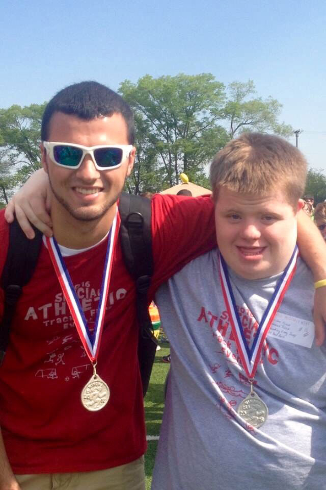 Tyler hanging out with a student at the Special Athletic Competition.