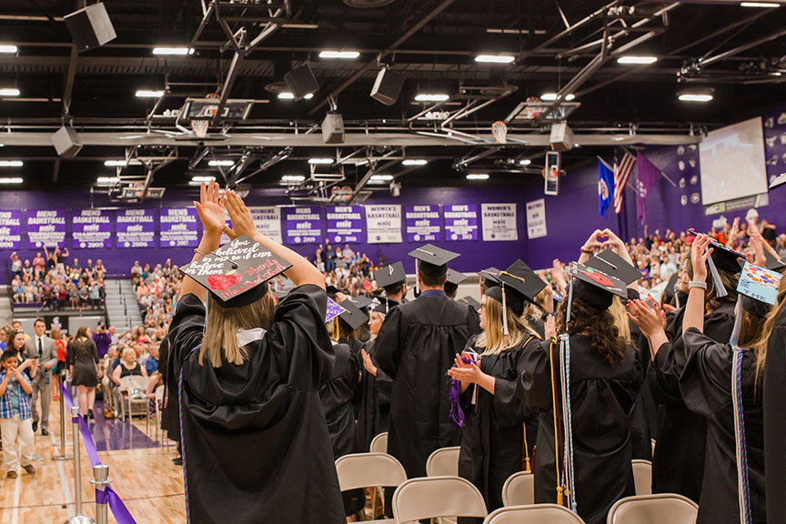 WSU graduates clapping during the graduation ceremony.