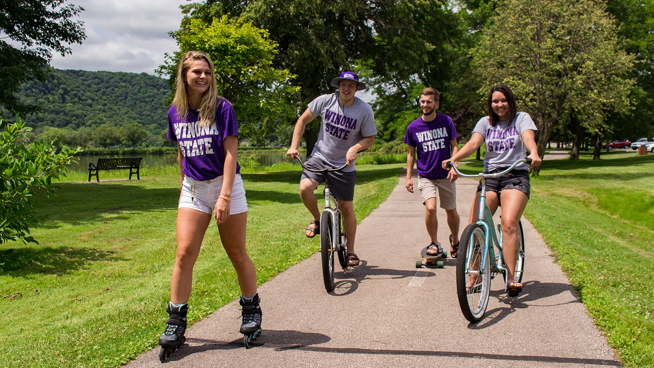 A group of WSU student bike and roller blade on the trail around Lake Park. 
